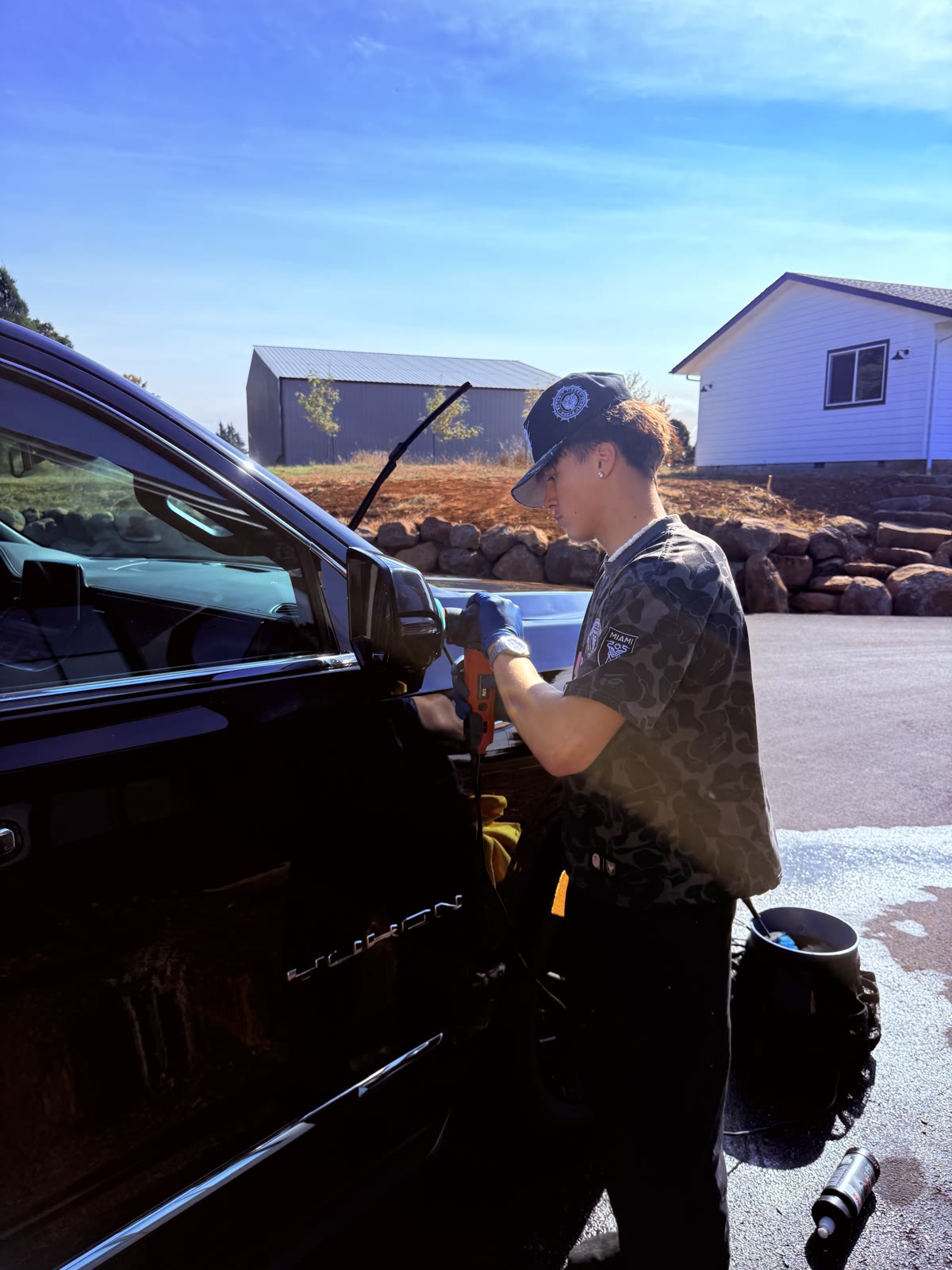 Hands-on detail work on a Jeep, mirror and door jamb